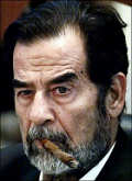 Saddam Smokes a Stogie